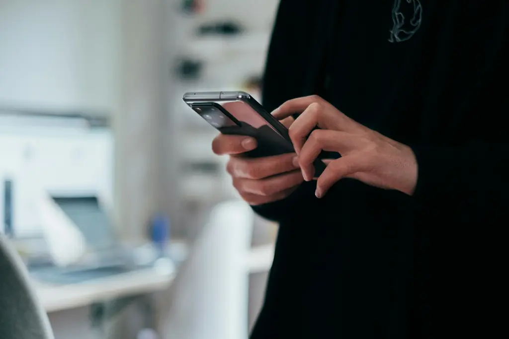 Hands holding a smartphone